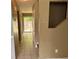 Long hallway with tiled flooring, connecting various rooms in the house at 1807 Ashborough Se Cir # B, Marietta, GA 30067