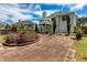 Spacious backyard with stone patio, mature trees, and landscaping at 5414 Sweetsprings Sw Dr, Powder Springs, GA 30127