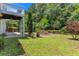 Spacious backyard has lush lawn area and features a concrete patio area at 5414 Sweetsprings Sw Dr, Powder Springs, GA 30127