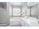 Bathroom with double sink vanity, soaking tub, and separate shower at 5414 Sweetsprings Sw Dr, Powder Springs, GA 30127