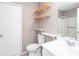 Bathroom featuring a toilet, vanity with a sink, mirror, and a walk in shower at 5414 Sweetsprings Sw Dr, Powder Springs, GA 30127