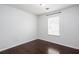 Cozy bedroom with light-colored walls and hardwood floors, filled with natural light at 5414 Sweetsprings Sw Dr, Powder Springs, GA 30127