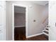 Entryway featuring hardwood floors, neutral walls, stairs, and closet space at 5414 Sweetsprings Sw Dr, Powder Springs, GA 30127