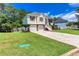 Charming two-story home with a lush green lawn and two-car garage at 5414 Sweetsprings Sw Dr, Powder Springs, GA 30127