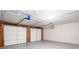 Spacious two-car garage featuring a newly installed garage door and opener at 5414 Sweetsprings Sw Dr, Powder Springs, GA 30127