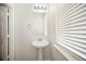 Bathroom featuring pedestal sink and window at 920 Society Sw Cir, Atlanta, GA 30331