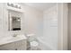 Bright bathroom featuring a vanity, toilet, and a shower-tub combination at 920 Society Sw Cir, Atlanta, GA 30331