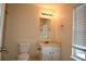 Bathroom with natural light, white vanity with a marble countertop and neutral walls at 920 Society Sw Cir, Atlanta, GA 30331