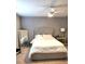 Cozy bedroom featuring soft carpeting, a queen bed, and neutral wall colors at 920 Society Sw Cir, Atlanta, GA 30331