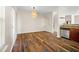 Dining area with hardwood floors and a modern pendant light at 920 Society Sw Cir, Atlanta, GA 30331