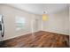 Dining area with hardwood floors, natural light, and a modern pendant light at 920 Society Sw Cir, Atlanta, GA 30331
