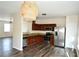 Kitchen with stainless steel appliances, hardwood floors, wood cabinets, and granite counters at 920 Society Sw Cir, Atlanta, GA 30331