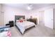 Cozy main bedroom features neutral walls, carpet floors and a comfortable-looking bed at 920 Society Sw Cir, Atlanta, GA 30331