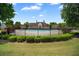 Beautiful community pool surrounded by lush landscaping and wrought iron fence on a sunny day at 920 Society Sw Cir, Atlanta, GA 30331
