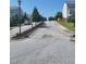 Street view of neighborhood with street lights and neatly manicured landscaping and sidewalks at 920 Society Sw Cir, Atlanta, GA 30331
