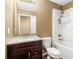 Well-lit bathroom featuring a modern vanity, granite countertop, and a shower-tub combination at 1382 Hollenbeck Ln, Riverdale, GA 30296