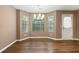 Cozy dining area with ample natural light and hardwood flooring, perfect for Gathering meals at 1382 Hollenbeck Ln, Riverdale, GA 30296