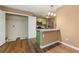 Eat-in kitchen featuring granite countertops, green cabinets, and stainless steel appliances at 1382 Hollenbeck Ln, Riverdale, GA 30296
