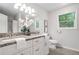 Bathroom with double vanity, granite countertops, and updated fixtures at 1580 Lower Burris Rd, Canton, GA 30114