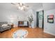 Bedroom featuring hardwood floors, a ceiling fan, and colorful décor with an ABC rug at 1580 Lower Burris Rd, Canton, GA 30114