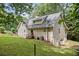 Two story home featuring backyard with mature trees and lawn at 1580 Lower Burris Rd, Canton, GA 30114