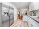 Bright kitchen with stainless steel refrigerator, and white cabinets at 1580 Lower Burris Rd, Canton, GA 30114