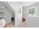Bright laundry room with tile flooring, washer, dryer, and shelving at 1580 Lower Burris Rd, Canton, GA 30114