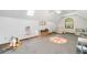 Spacious playroom with skylight, toys, carpeted floor, and seating area at 1580 Lower Burris Rd, Canton, GA 30114
