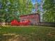 Wood exterior and large wooden deck with fenced in backyard at 5642 Dorsett Shoals Rd, Douglasville, GA 30135