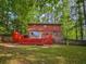 Large red deck and fenced in yard at 5642 Dorsett Shoals Rd, Douglasville, GA 30135