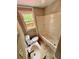 Compact bathroom featuring a tub/shower combo, toilet, and sink with a window offering outdoor views at 5642 Dorsett Shoals Rd, Douglasville, GA 30135