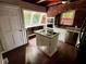 Country kitchen with stainless steel appliances and island cooktop at 5642 Dorsett Shoals Rd, Douglasville, GA 30135
