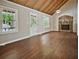 Bright living room featuring a stone fireplace and hardwood floors at 5642 Dorsett Shoals Rd, Douglasville, GA 30135
