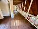 The loft features wood ceilings, and wood floors and overlooks the living room at 5642 Dorsett Shoals Rd, Douglasville, GA 30135