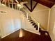 A staircase leads to a loft area with hardwood floors in this bright house at 5642 Dorsett Shoals Rd, Douglasville, GA 30135