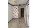 Bedroom with vintage wallpaper and natural light, offering renovation potential for a buyer at 809 Camelot Dr # 809, College Park, GA 30349