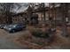 Multi-Gathering building featuring vintage facade, balconies, a tower detail, parking, and mature trees at 809 Camelot Dr # 809, College Park, GA 30349