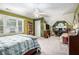 This roomy bedroom features a sitting area, vaulted ceilings, and lots of shelving for storage or decoration at 1655 Peachcrest Dr, Lawrenceville, GA 30043