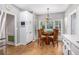 Bright breakfast nook adjacent to kitchen features large windows and modern lighting at 1655 Peachcrest Dr, Lawrenceville, GA 30043