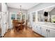 Sunlit breakfast nook located adjacent to the kitchen area with hardwood flooring at 1655 Peachcrest Dr, Lawrenceville, GA 30043