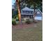 Charming two-story home featuring a well-manicured front yard and a welcoming front porch at 1655 Peachcrest Dr, Lawrenceville, GA 30043