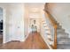Bright foyer with hardwood floors and staircase leading to the second floor, lots of natural light at 1655 Peachcrest Dr, Lawrenceville, GA 30043