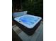 Close up view of a hot tub with blue lights illuminating the water at 1655 Peachcrest Dr, Lawrenceville, GA 30043