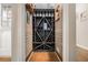 Dedicated wine cellar provides ample storage for wine bottles and glassware at 1655 Peachcrest Dr, Lawrenceville, GA 30043
