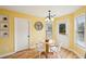 Cozy breakfast nook with a round table, natural light, and views of the surrounding landscape at 5686 Grindstone Dr, Buford, GA 30518