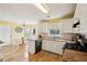 Bright eat-in kitchen with white cabinets, an island, and stainless steel appliances for a modern feel at 5686 Grindstone Dr, Buford, GA 30518