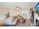 Spacious living room with hardwood floors, a cozy fireplace, and an open floor plan to the dining area at 5686 Grindstone Dr, Buford, GA 30518