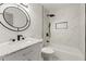 Modern bathroom featuring stylish tiles, elegant vanity, and upgraded shower head at 732 Jamestown Xing, Jonesboro, GA 30238