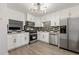 Modern kitchen featuring stainless steel appliances, stylish backsplash and new lighting at 732 Jamestown Xing, Jonesboro, GA 30238