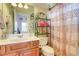 Bathroom featuring a vanity, toilet, and decorative shower curtain at 805 Cog Hl, Mcdonough, GA 30253